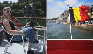 Een vrouw geniet van het landschap en de zon op een boot.