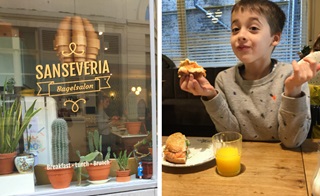 Een jongen eet een bagel in Bagelsalon Sanseveria